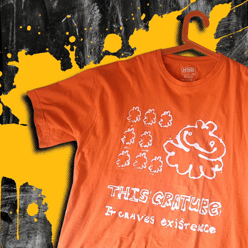 a shirt with creature design painted